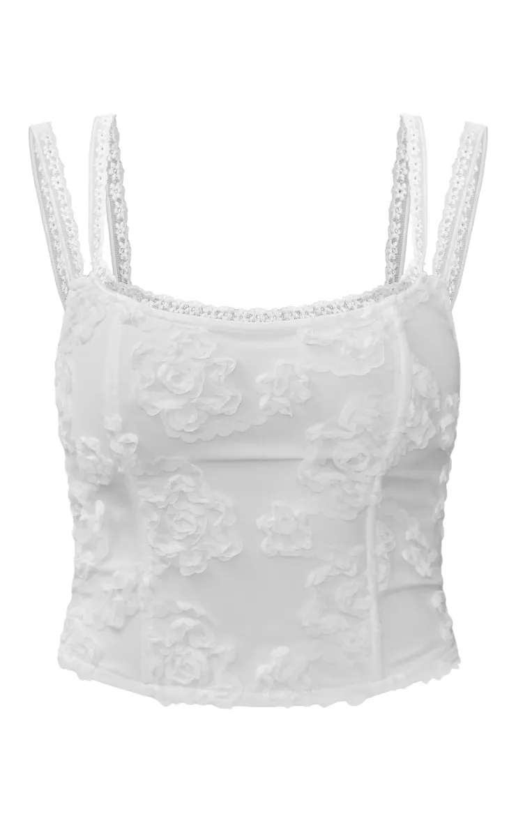 Corset blanc à fleurs et liserés