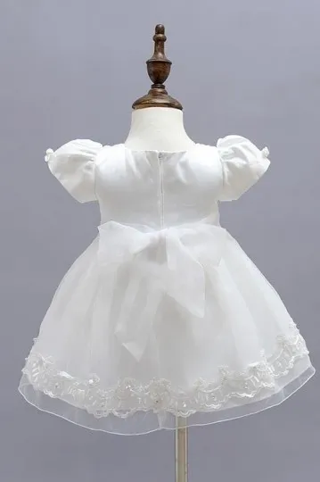 Petite robe cérémonie bébé ivoire en dentelle à mancheron