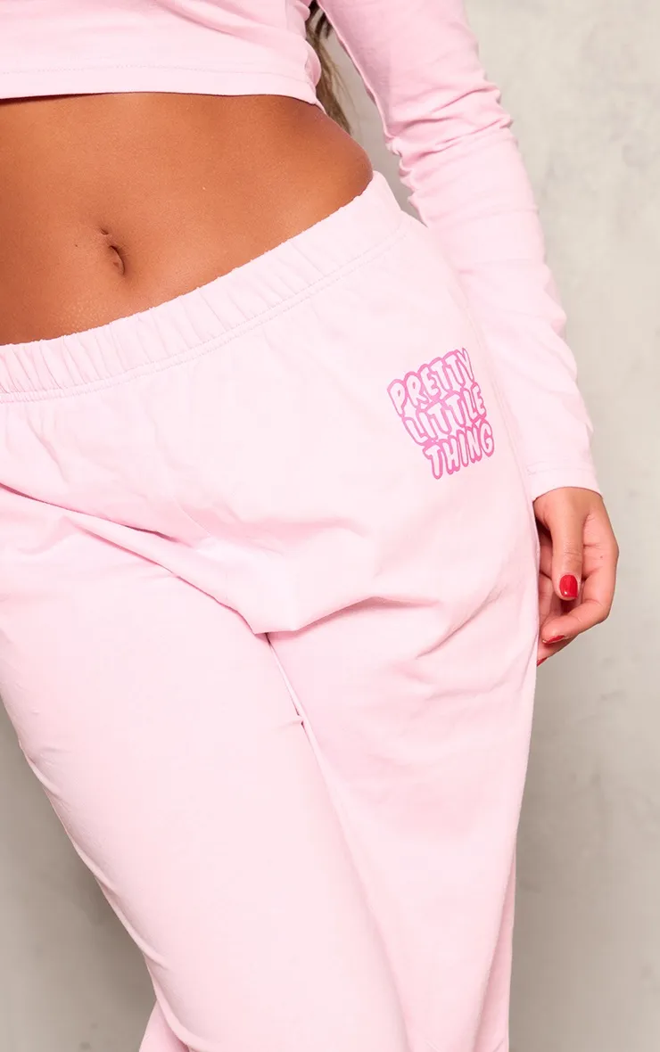 PRETTYLITTLETHING Pantalon large en coton rose clair à logo